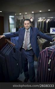 Sales associate in menswear store in mall