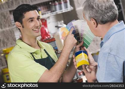 Sales clerk assisting a customer in a hardware store