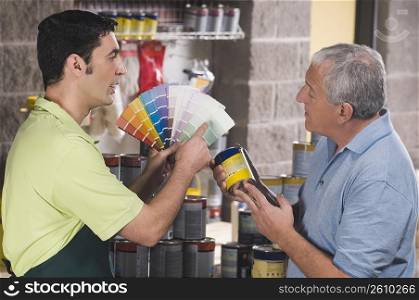 Sales clerk assisting a customer in a hardware store