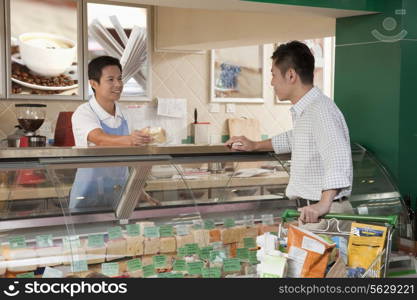 Sales Clerk assisting man at the Deli counter, Beijing