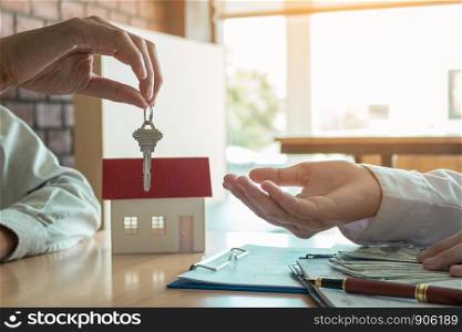 Salesman home brokers provide key to new homeowners.