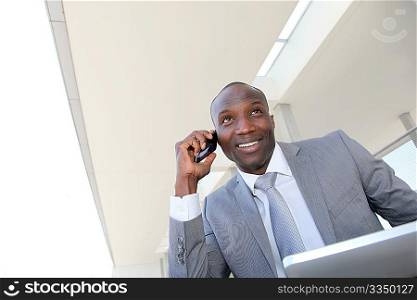 Salesman on business travel using electronic tablet