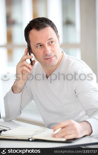 Salesman on the phone in the office