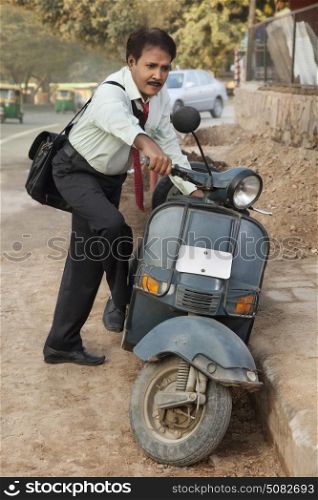 Salesman starting up scooter