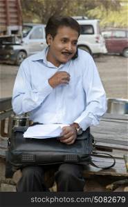Salesman talking on a mobile phone and smiling