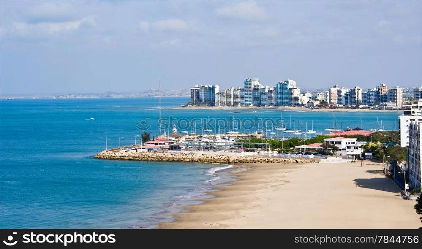 Salinas beach with apartment buildings and yacht club in Ecuador, Pacific Coast