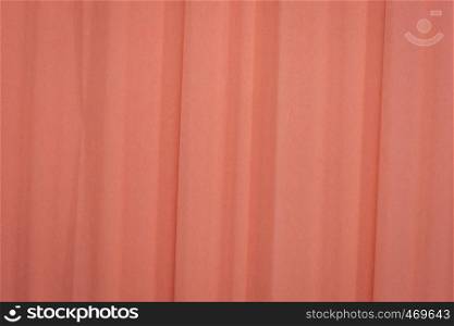 salmon color crepe paper - background with crinkled texture