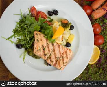 Salmon fillet steak in white plate Healthy food style. Salmon fillet steak