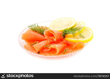 Salmon fillet with lemon and dill on plate isolated on white background.