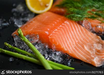 salmon fillet with lemon asparagus herb and spices, fresh raw salmon fish on ice for cooking food seafood salmon fish
