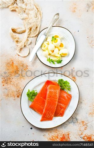 salmon fish and butter on a table, stock photo