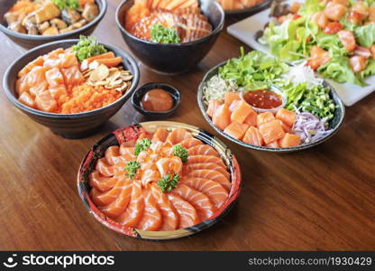 salmon fish fillet served with fresh vegetables on dish, set of japanese style seafood dishes. salmon fish fillet served with fresh vegetables