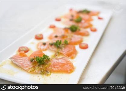 Salmon Fish Raw salmon fillet pepper salt dill lemon rosemary on plate
