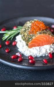 Salmon in mint sauce with red caviar and ricotta