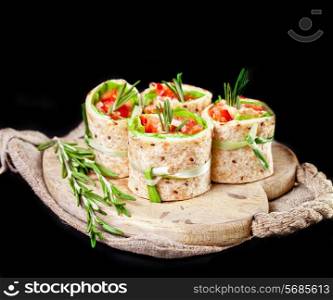 Salmon lavash rolls with fresh salad leafs