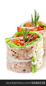 Salmon lavash rolls with fresh salad leafs