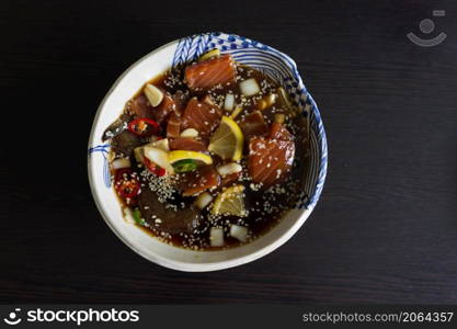 Salmon marinated shoyu or salmon pickled soy sauce in Korean style .