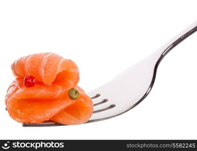 Salmon piece on fork isolated on white background cutout