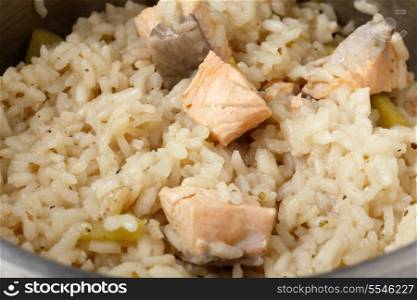 Salmon risotto cooking in a saucepan