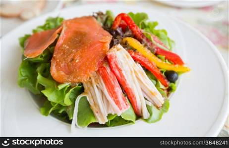 Salmon salad with avocado and sweet pepper, japanese gourmet appetizer