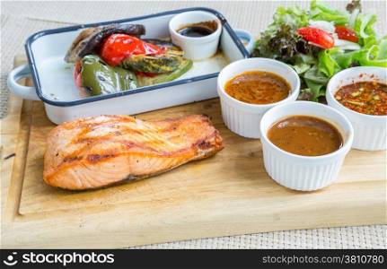 salmon steak with grilled vegetable and assorted sauce
