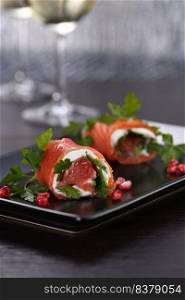 Salmon strip with cream cheese and grapefruit, rolled up. These bite-sized rounds are a great option to serve as an appetizer aperitif, a perfect, festive recipe.
