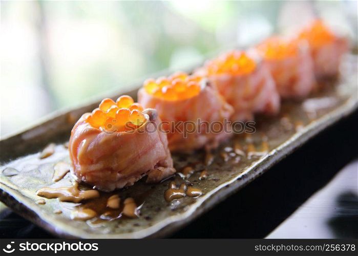 Salmon sushi ball with salmon caviar