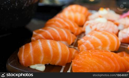 Salmon Sushi Japanese food. on the table in restaurant. Japanese cuisine Sashimi Salmon sushi nigiri.