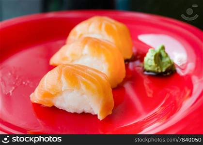 salmon sushi on plate, japanese style cuisine .