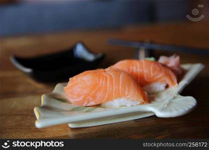 Salmon Sushi on wood background