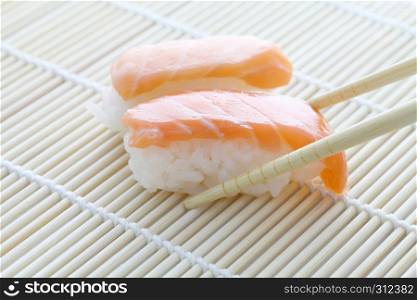 Salmon sushi with chopsticks