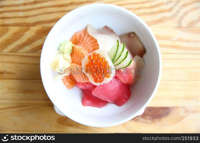 salmon sushi with rice on wood background