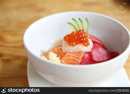 salmon sushi with rice on wood background