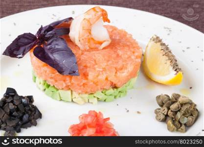 Salmon tartar. tartar salad with salmon and avocado