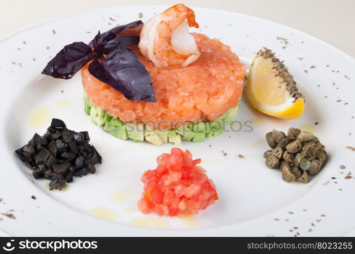 Salmon tartar. tartar salad with salmon and avocado