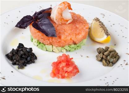 Salmon tartar. tartar salad with salmon and avocado