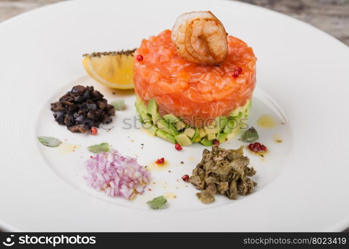 Salmon tartar. tartar salad with salmon and avocado