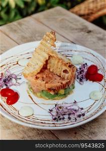 Salmon tartare with avocado and toasts ideal for summer