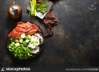 salmon with bread and creamcheese on plate