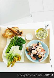 Salsa verde, mixed seafood, fennel, zucchini, asparagus, broccolini and bread
