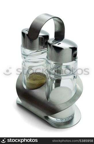 Salt and pepper shakers in steel holder isolated on white