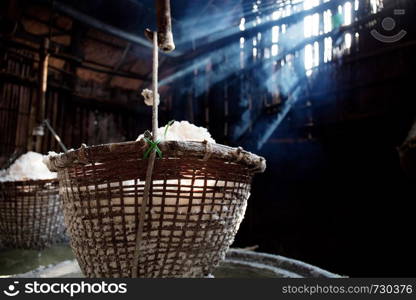 Salt basket hanging on fireplace with the sunlight in countryside.