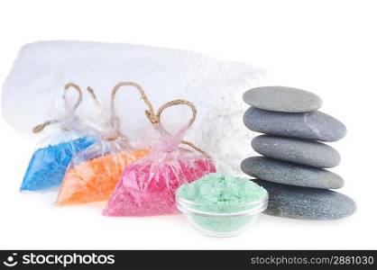 salt for bath, towel and stones on white background
