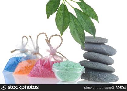 salt for bath, towel and stones on white background