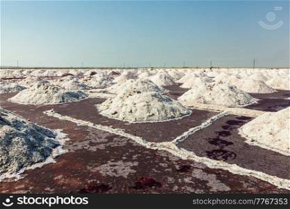 Salt heaps at salt mine at Sambhar Lake, Sambhar, Rajasthan, India. Salt mine at Sambhar Lake, Sambhar, Rajasthan, India