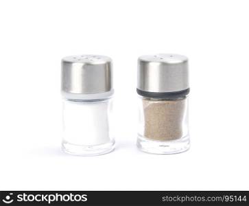 Saltshaker and pepper caster on white