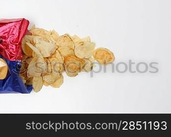 Salty potato chips isolated on white
