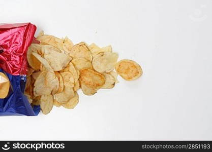 Salty potato chips isolated on white