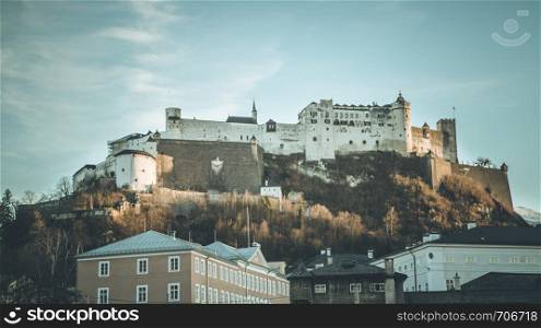 Salzburg in autumn: Fortress Hohensalzburg and blue, cloudy sky