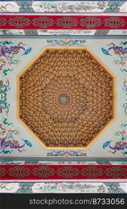 Samut Prakan, Thailand - Nov 18, 2022   Elaborate sculptures of octagonal shape on ceiling design of Wat thamma katanyu or Tham Katanya Shrine Foundation  Sian Lor Tai Tian Gong . Taiwanese temple, Selective focus.